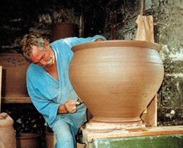 Mike Goddard at Studio Pottery creating one of his garden pots